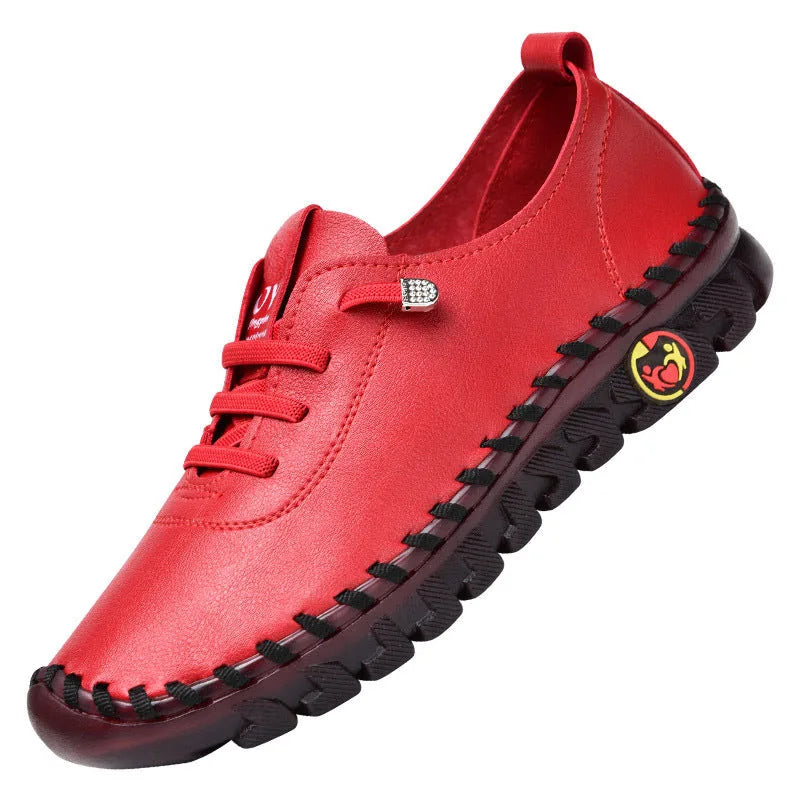 Red shoe with black sole on a white background