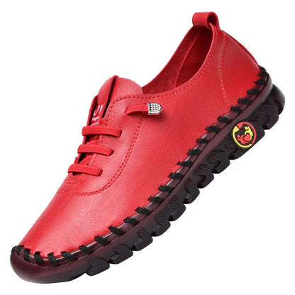 Red shoe with black sole on a white background